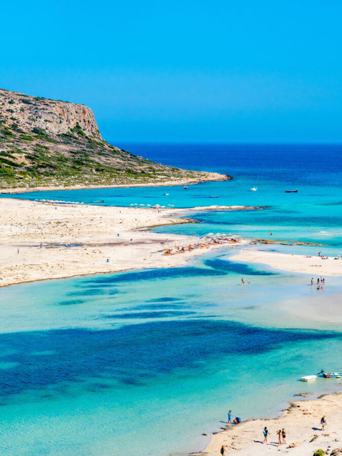 Aerial view of Balos Lagoon in Crete, Greece, showcasing a stunning beach and vibrant blue sea.