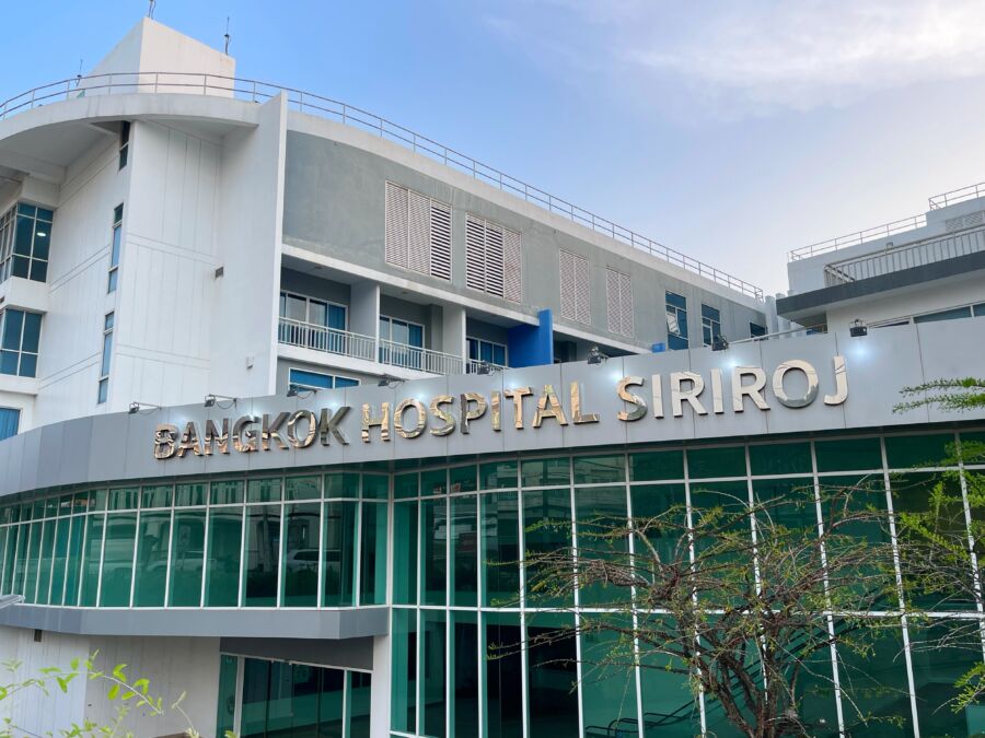 Exterior view of Bangkok Hospital Siriroj in Phuket, featuring the BDMS sign prominently displayed