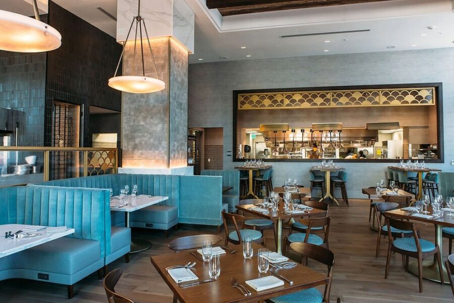 Interior view of the Bargello Asheville restaurant, showcasing elegant seating and a vibrant dining environment.