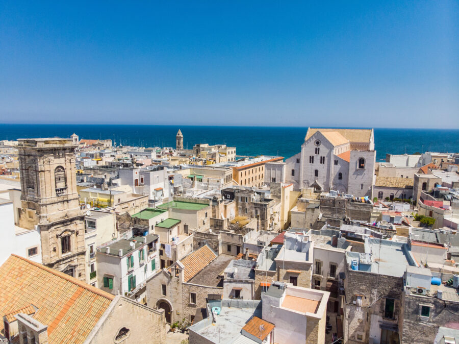 Aerial view of Bari vecchia, Apulia, showcasing the old town under bright sunlight on a clear day.