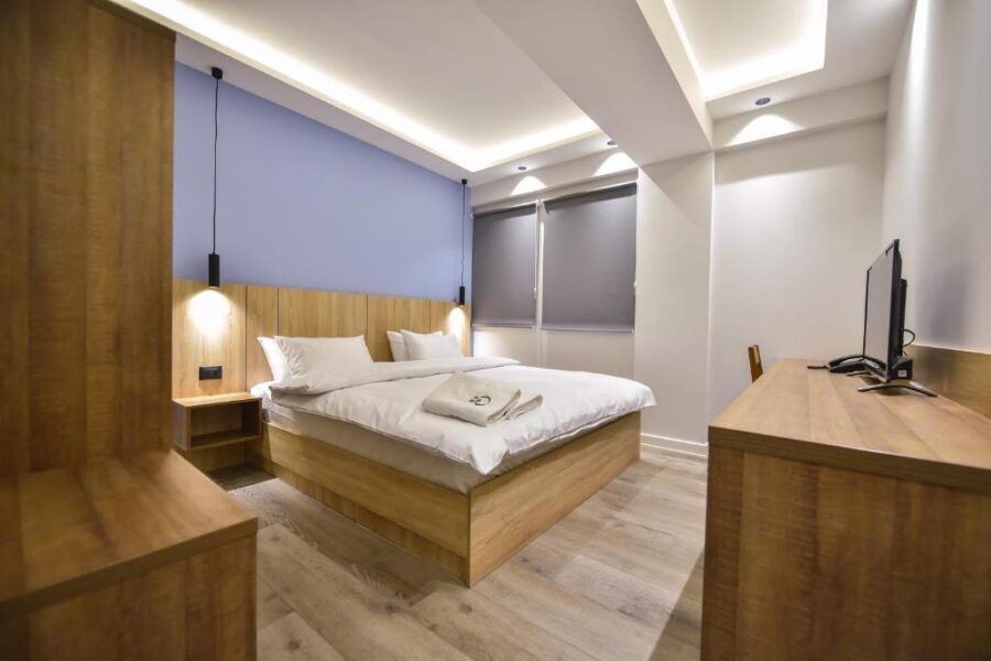 Interior view of a stylish room with a comfortable bed at the Baron Boutique Hotel in Yerevan, Armenia.
