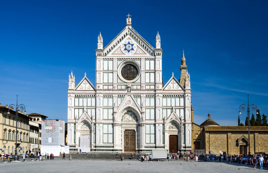 Front exterior of Santa Croce church in Florence, Italy, showcasing its ornate façade and iconic Gothic architecture