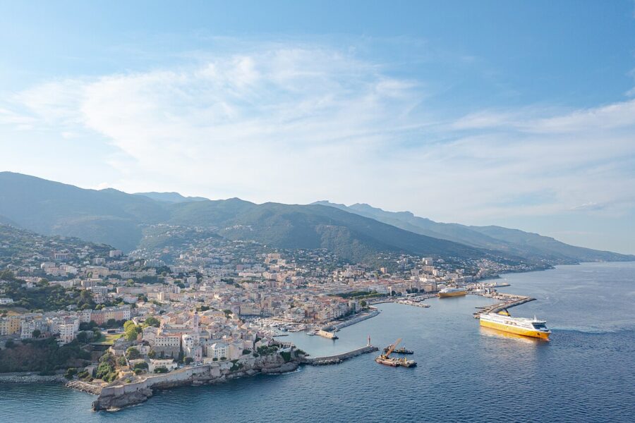 Aerial image showing a boat on the water close to the town of Bastia, Corsica, France.