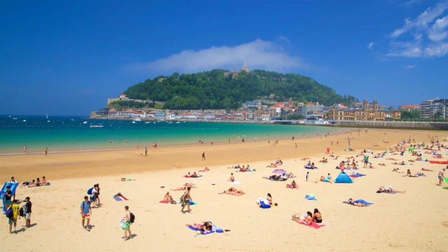 La Concha Beach, San Sebastián, Spain: sandy bay with sunbathers and turquoise water.