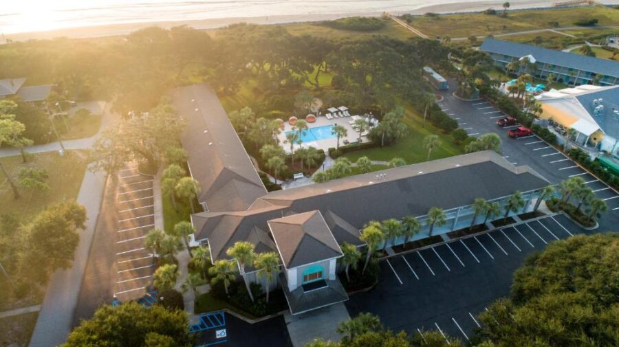 Aerial view of Beachview Club Hotel on Jekyll Island, showcasing the hotel and surrounding beach landscape.
