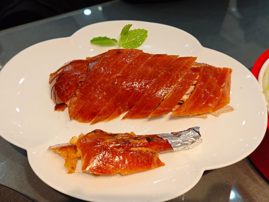Plate of sliced and arranged Beijing roasted Peking duck