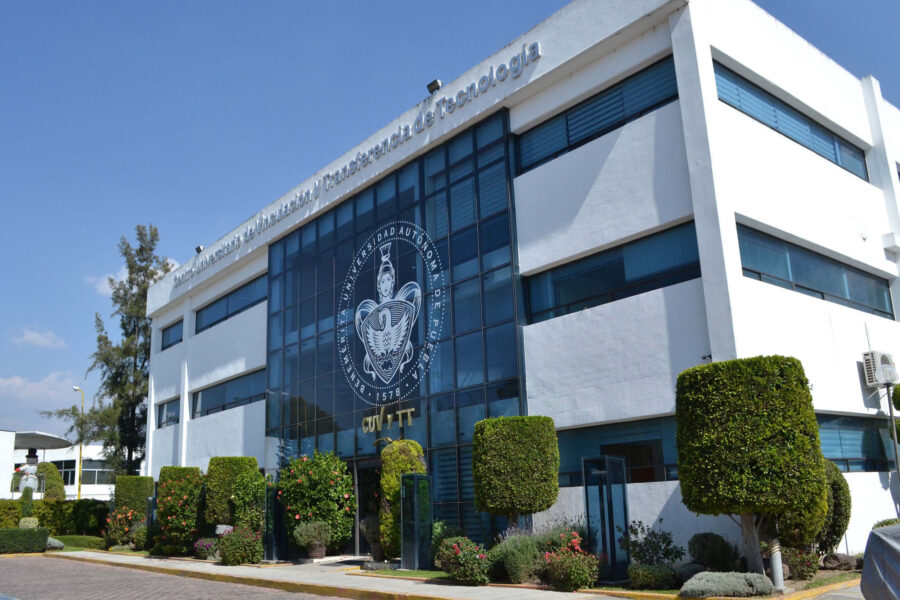 Exterior view of the Benemérita Universidad Autónoma de Puebla, showcasing its architectural design and surrounding landscape.
