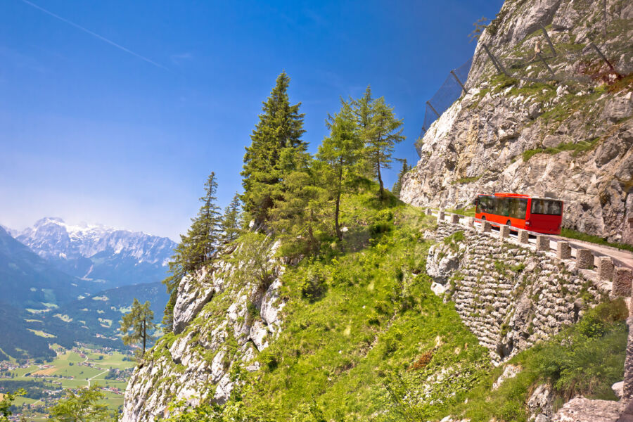 Red bus on Kehlsteinstraße, a scenic road in the Alps leading to Eagle's Nest, Berchtesgaden, Germany