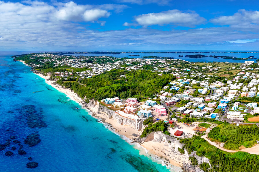 Aerial panorama of Bermuda Island showcasing its turquoise waters, lush greenery, and vibrant coastal scenery