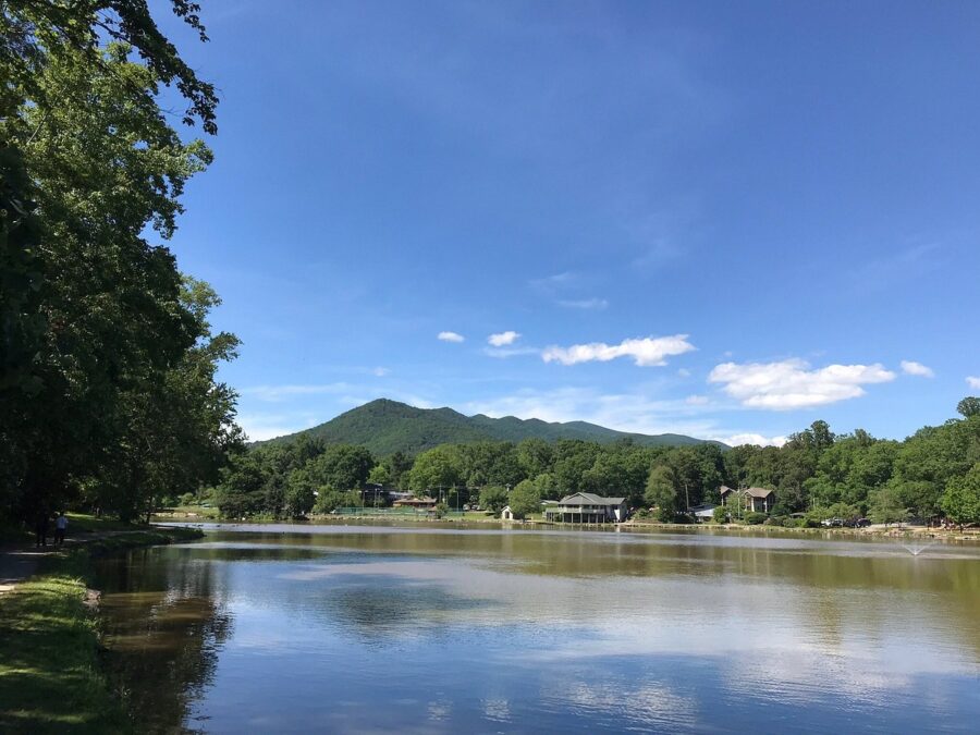 Scenic view of a lake with Black Mountain rising majestically in the background, representing North Carolina's beauty.