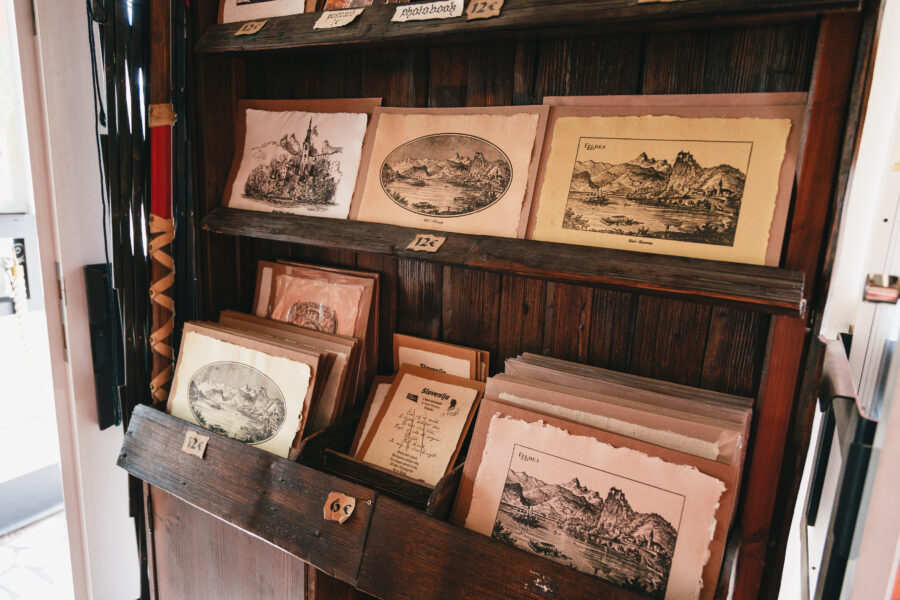 Vintage postcards featuring landscapes, printed on a Gutenberg-style press, available at the Bled Castle souvenir shop