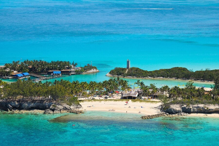 Aerial view of Blue Lagoon Island in Nassau, Bahamas, featuring a small island with a prominent lighthouse.