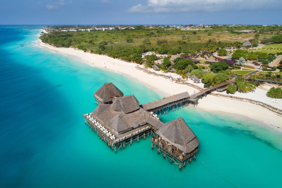 Top view of the blue lagoon and wooden restaurant in Zanzibar, Tanzania