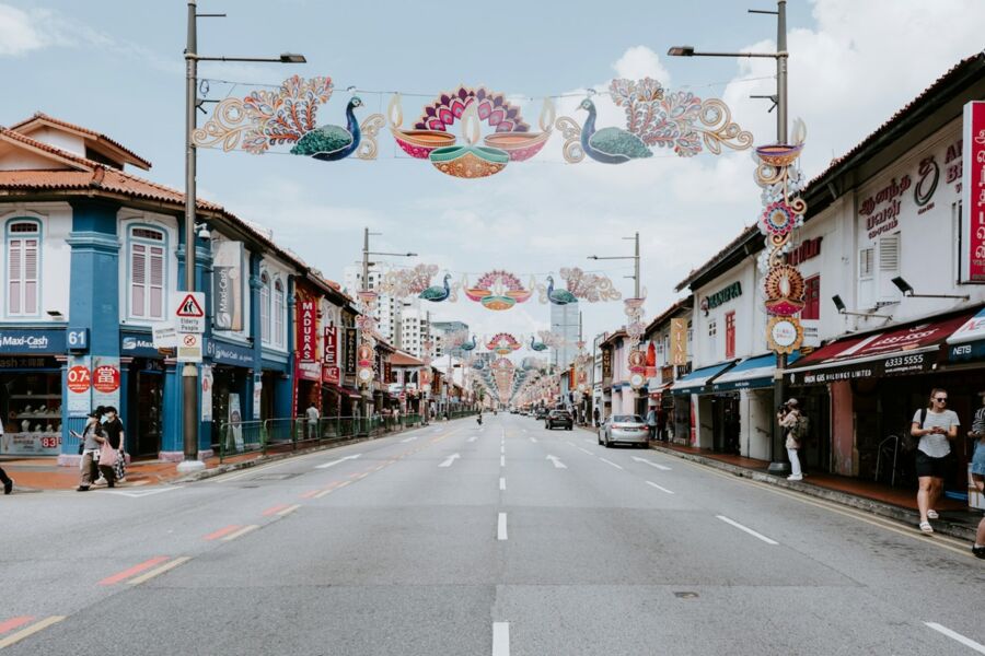 Vibrant Little India street with colorful shops and festive decorations celebrating cultural festivities.