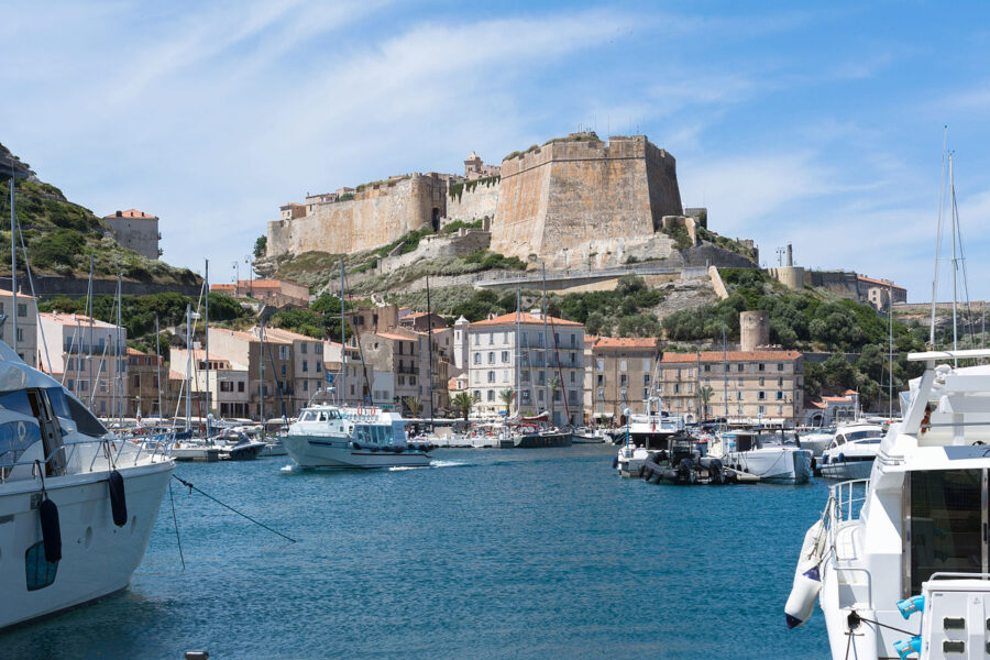 Bright blue sky dotted with white clouds above Bonifacio, Corsica, France
