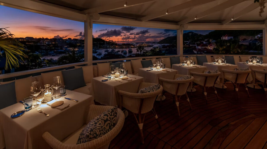Elegant interior of Bonito Saint Barth showcasing a luxurious dining experience with stylish decor and ambient lighting.
