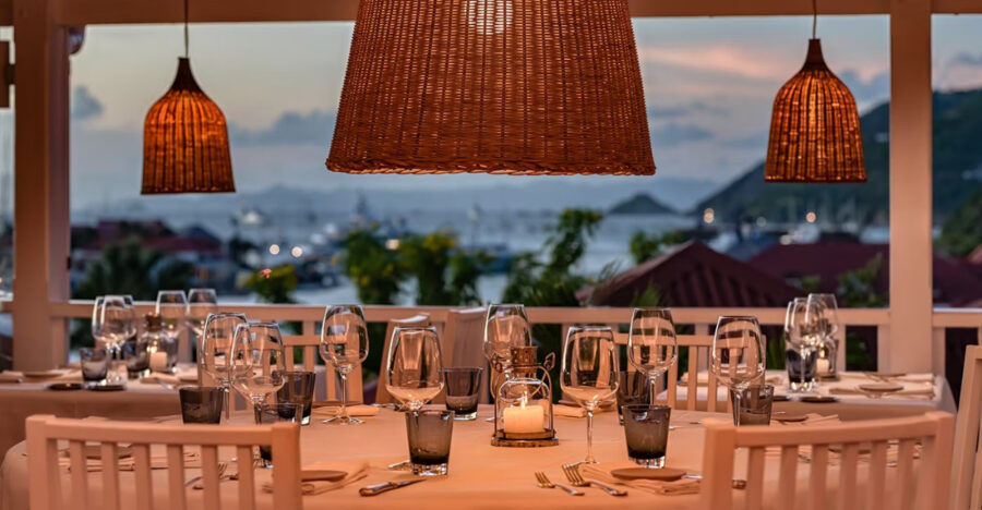 Close-up of a beautifully set table at Bonito Saint Barth restaurant, featuring elegant tableware and a tropical ambiance.