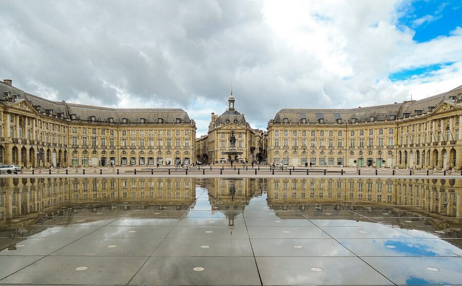 Place de la Bourse in Bordeaux with classic architecture and reflecting pool.