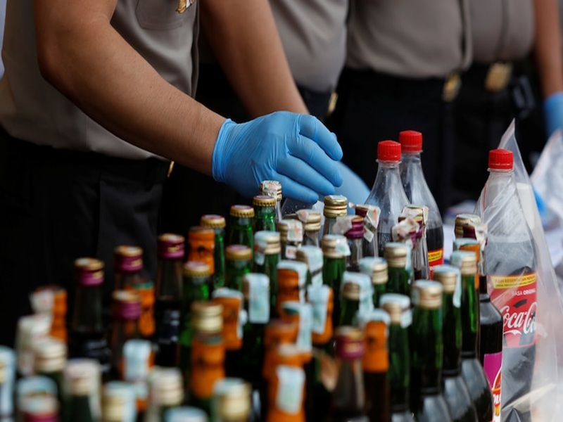 Law enforcement inspects beverages for methanol contamination during arak operation.