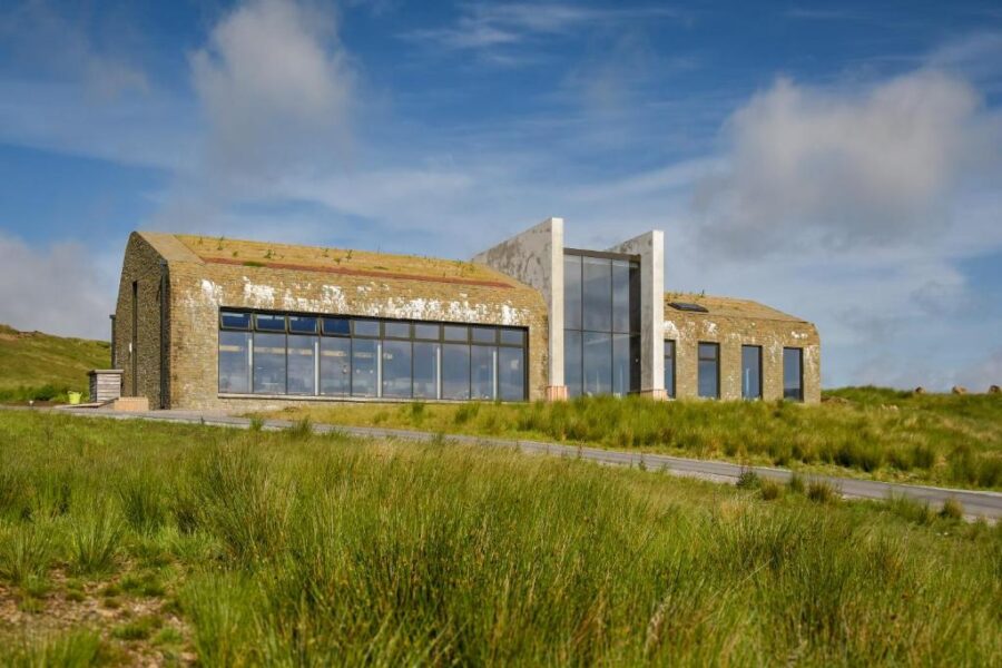 Bracken Hide Hotel on the Isle of Skye, featuring a stone exterior and multiple windows.
