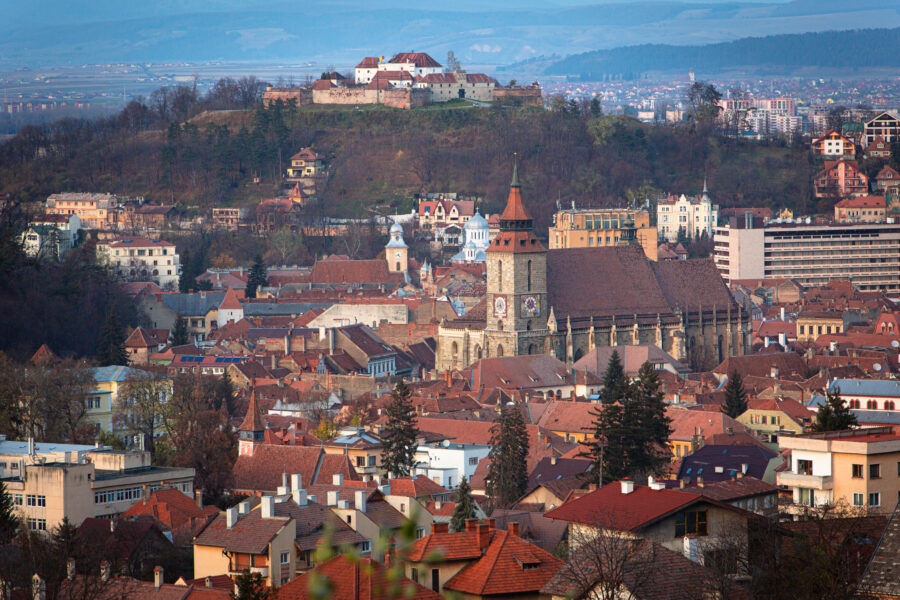 Panoramic view of Brasov City Center, highlighting its charming streets, historic landmarks, and vibrant public life.