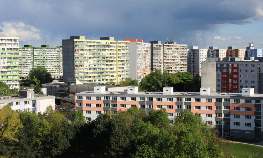 Urban scene in Bratislava, Slovakia, featuring modern apartment buildings and vibrant trees
