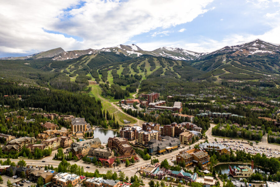 Aerial view of the rugged Rocky Mountains in Breckenridge, Colorado, showcasing dramatic peaks and scenic landscapes.