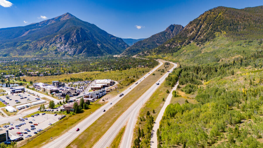 Aerial view of Breckenridge, Colorado in summer, showcasing lush greenery and scenic mountain landscapes