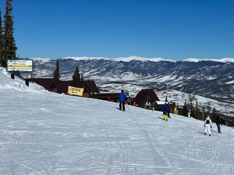 Skiers enjoy the scenic trail connecting Peak 8 and Peak 7 at Breckenridge Ski Resort, Colorado, amidst winter landscapes
