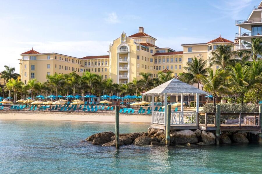 Scenic view of the beach at the British Colonial Nassau, Bahamas, featuring soft sand and clear blue waters.