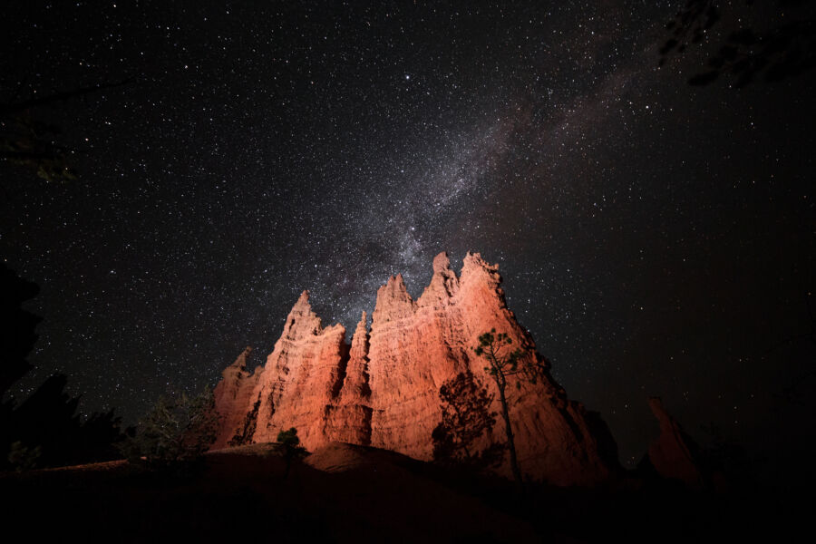 Stunning view of the Milky Way above Bryce Canyon National Park's hoodoos, captured during a summer night