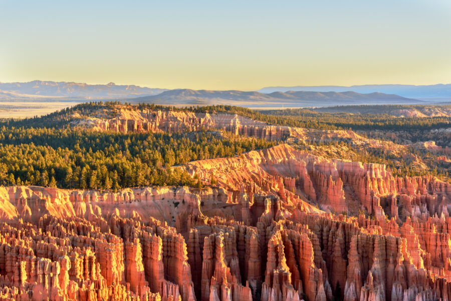 Sunrise over Bryce Canyon National Park, illuminating the unique rock formations