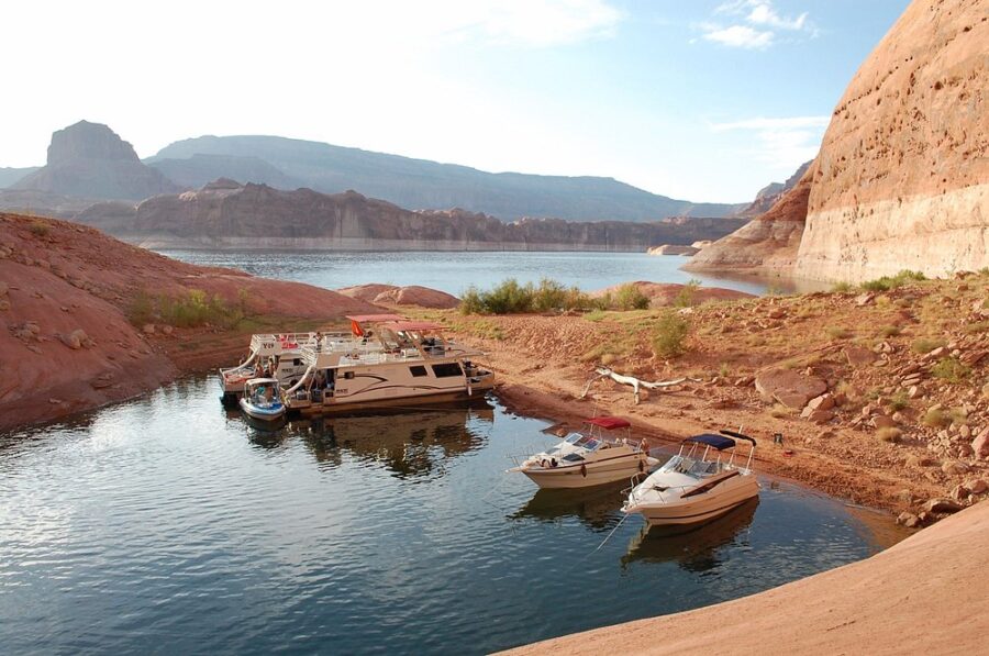 Boats lined up at Bullfrog Marina, resting on the tranquil surface of the lake.
