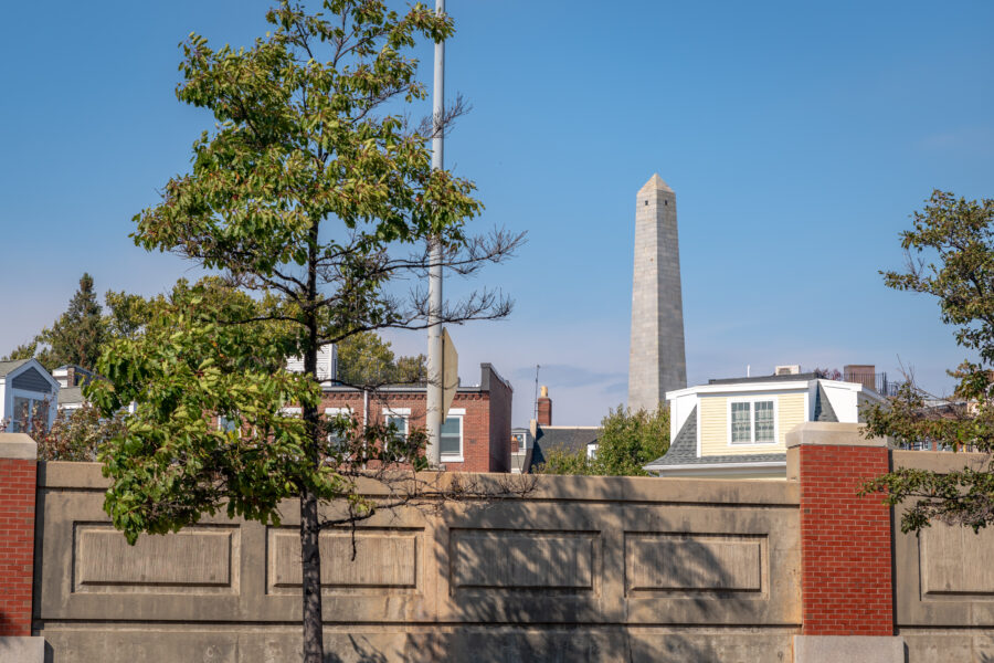 The Bunker Hill Monument, a tall granite obelisk, stands prominently in Boston, commemorating the Revolutionary War battle.