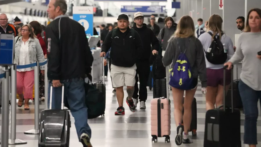 Busy airport terminal with diverse travelers and modern architecture.