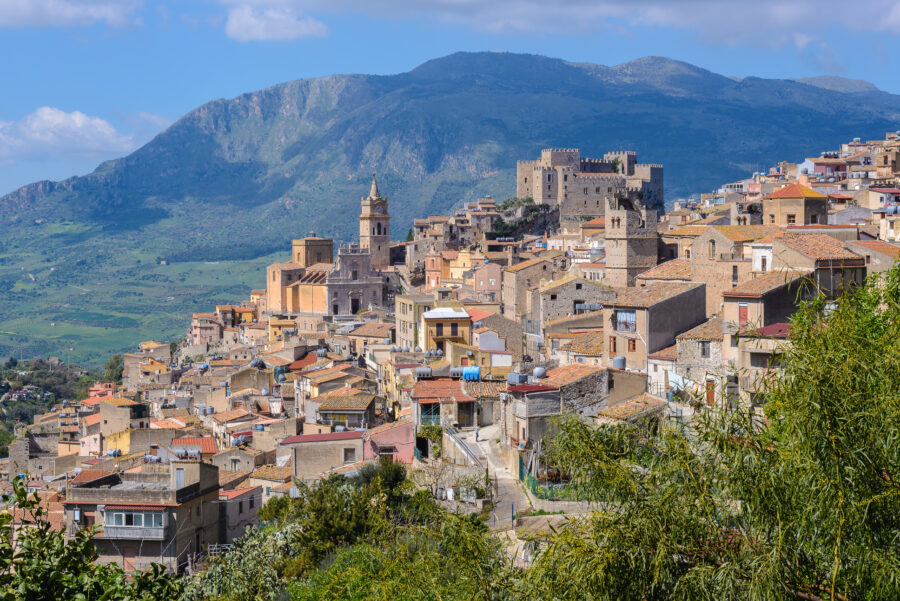 Scenic view of the medieval village of Caccamo, showcasing its historic architecture and surrounding landscape in Sicily, Italy.