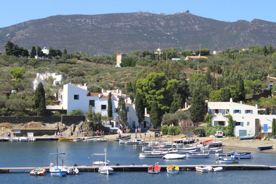 Bright blue sky above the picturesque landscapes of Cadaqués and Port Lligat in Spain, evoking tranquility.