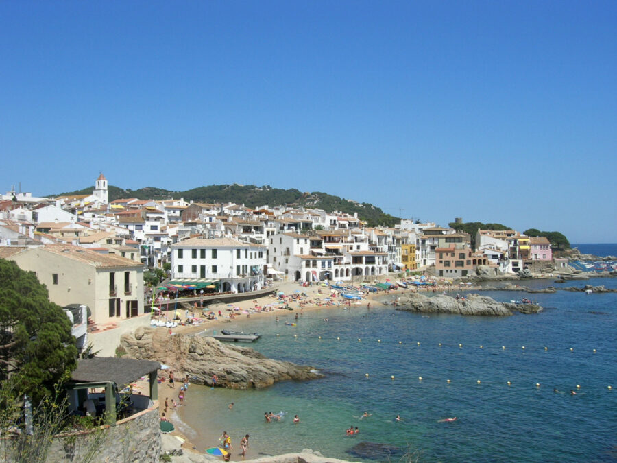 Aerial view of a clear blue sky over Calella de Palafrugell, Costa Brava, Spain.