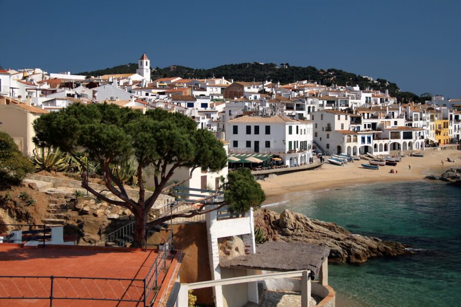 Panoramic view of a clear blue sky over Calella de Palafrugell, Spain, showcasing a serene and tranquil atmosphere.