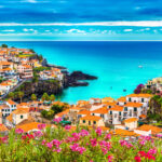 Scenic panorama of Camara de Lobos, highlighting the vibrant village and beautiful ocean views on Madeira island.