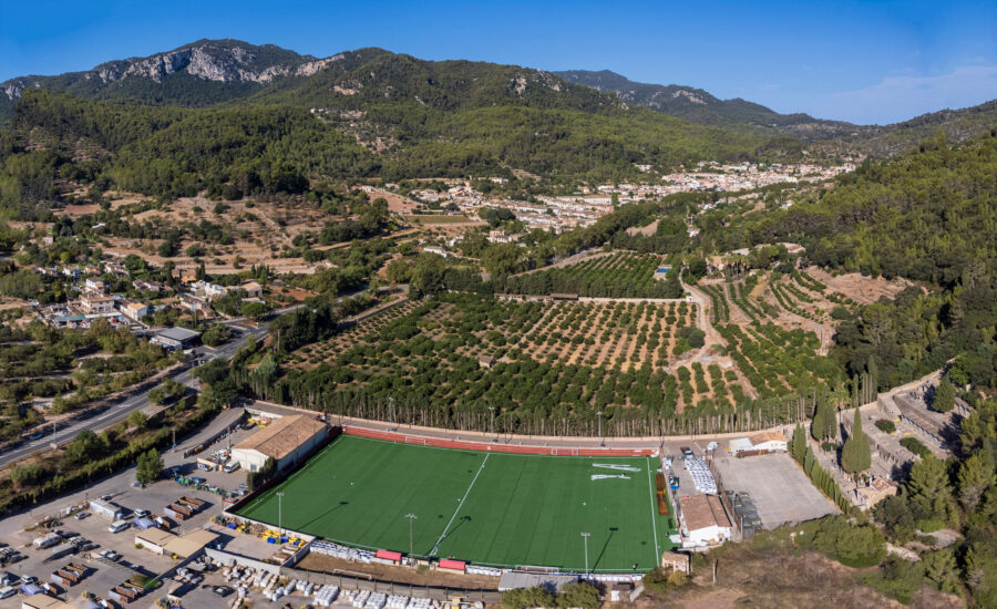 Panoramic view of Son Quint football field and surrounding valley in Esporles, Majorca, showcasing lush greenery and hills