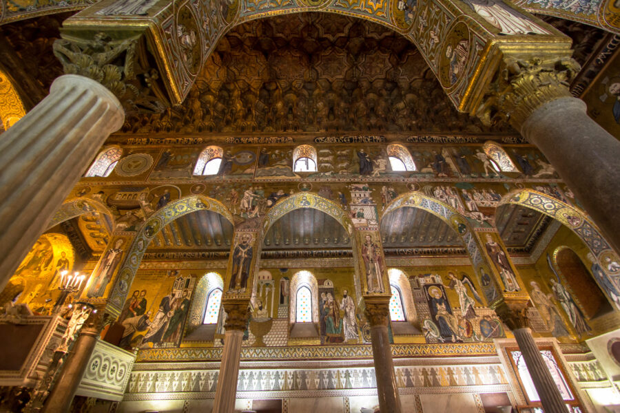 Interior view of the Palatine Chapel in Palermo, showcasing intricate mosaics and ornate architectural details