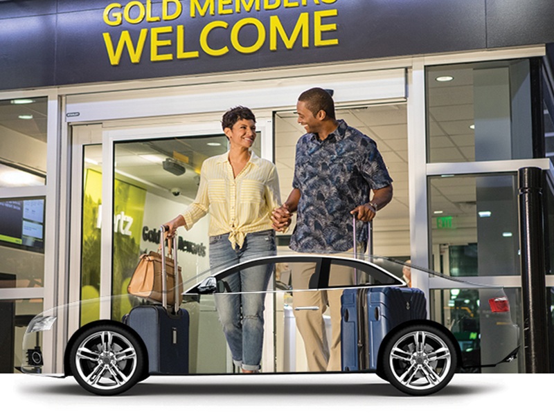 Premium car rental experience for gold members. Modern facility with happy travelers.
