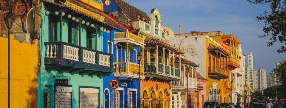 Colorful colonial architecture and lively street scene in historic Cartagena.