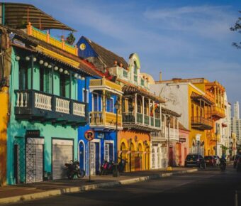 Colorful colonial architecture and lively street scene in historic Cartagena.