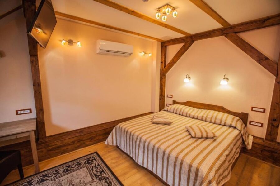 Interior view of a hotel room at Casa Wagner, showcasing a comfortable bed and inviting decor.