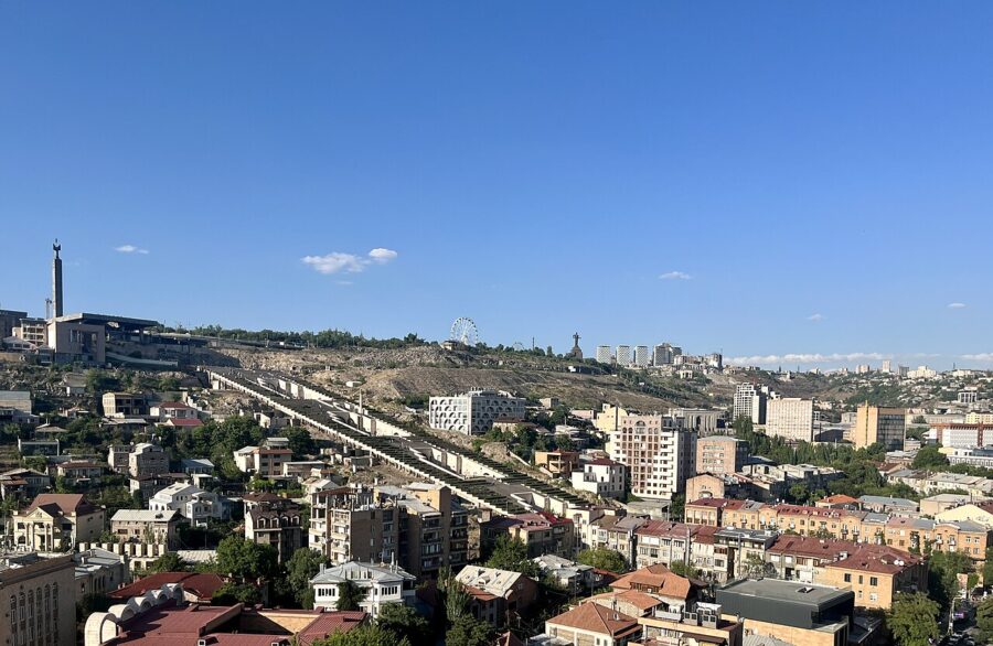 Scenic Yerevan, Armenia, showcasing a bridge over the city and a hill, with the Cascade Complex prominently displayed