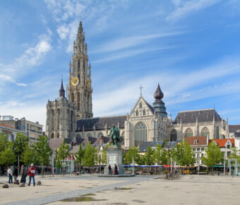 Cathedral and statue of Peter Paul Rubens in Antwerp, showcasing intricate architecture and historical significance.