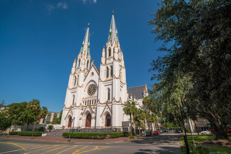 Exterior view of the Cathedral Basilica of St. John the Baptist in Savannah, Georgia, featuring intricate details and tall spires