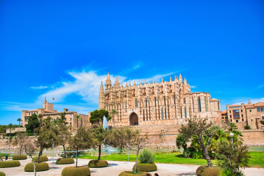 Panoramic view of the Cathedral of Santa Maria of Palma, highlighting its majestic spires and stunning architectural design